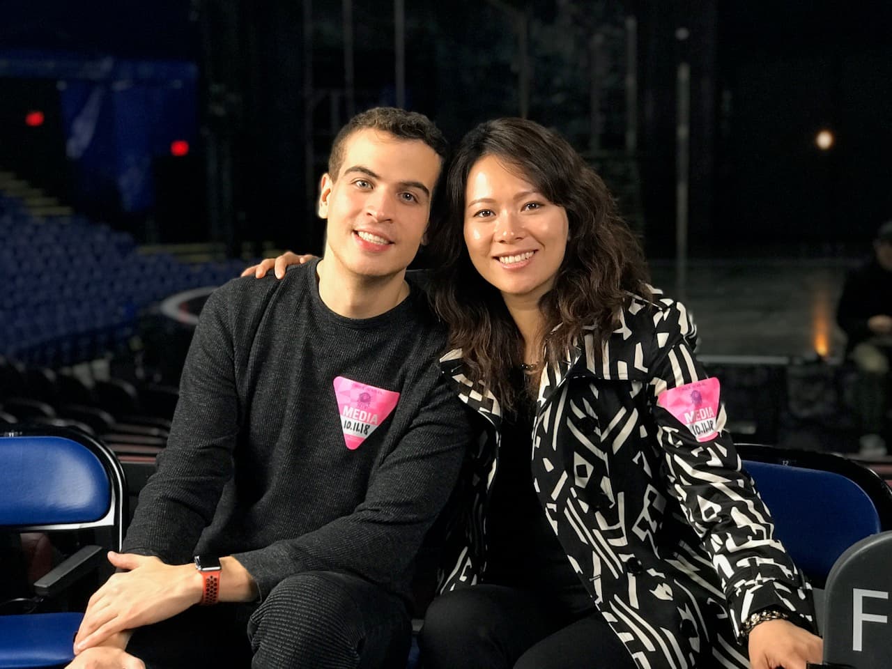 Germán Ceballos and Fei Wu with media badges at Cirque du Soleil