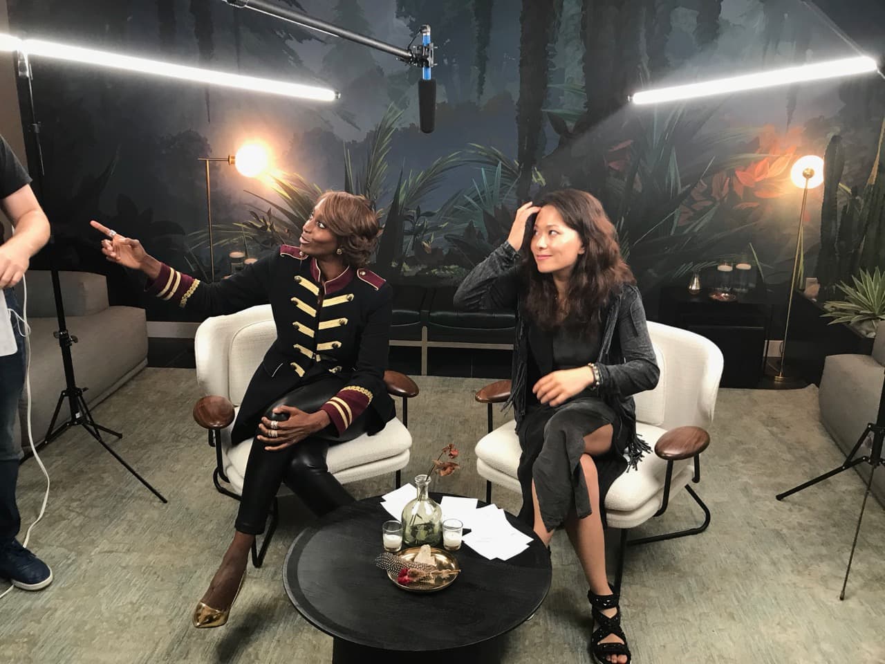 Bisila Bokoko and Fei Wu during interview filming with jungle backdrop
