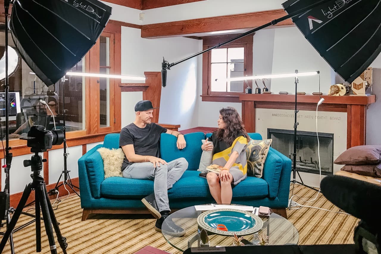 Behind the scenes filming Mick Ebeling interview with full lighting setup