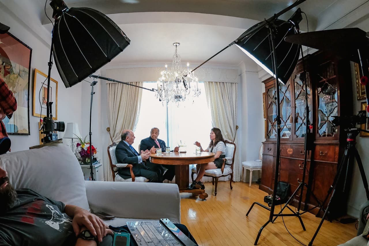 Filming Cosmo Buono and Barry Alexander at elegant dining table