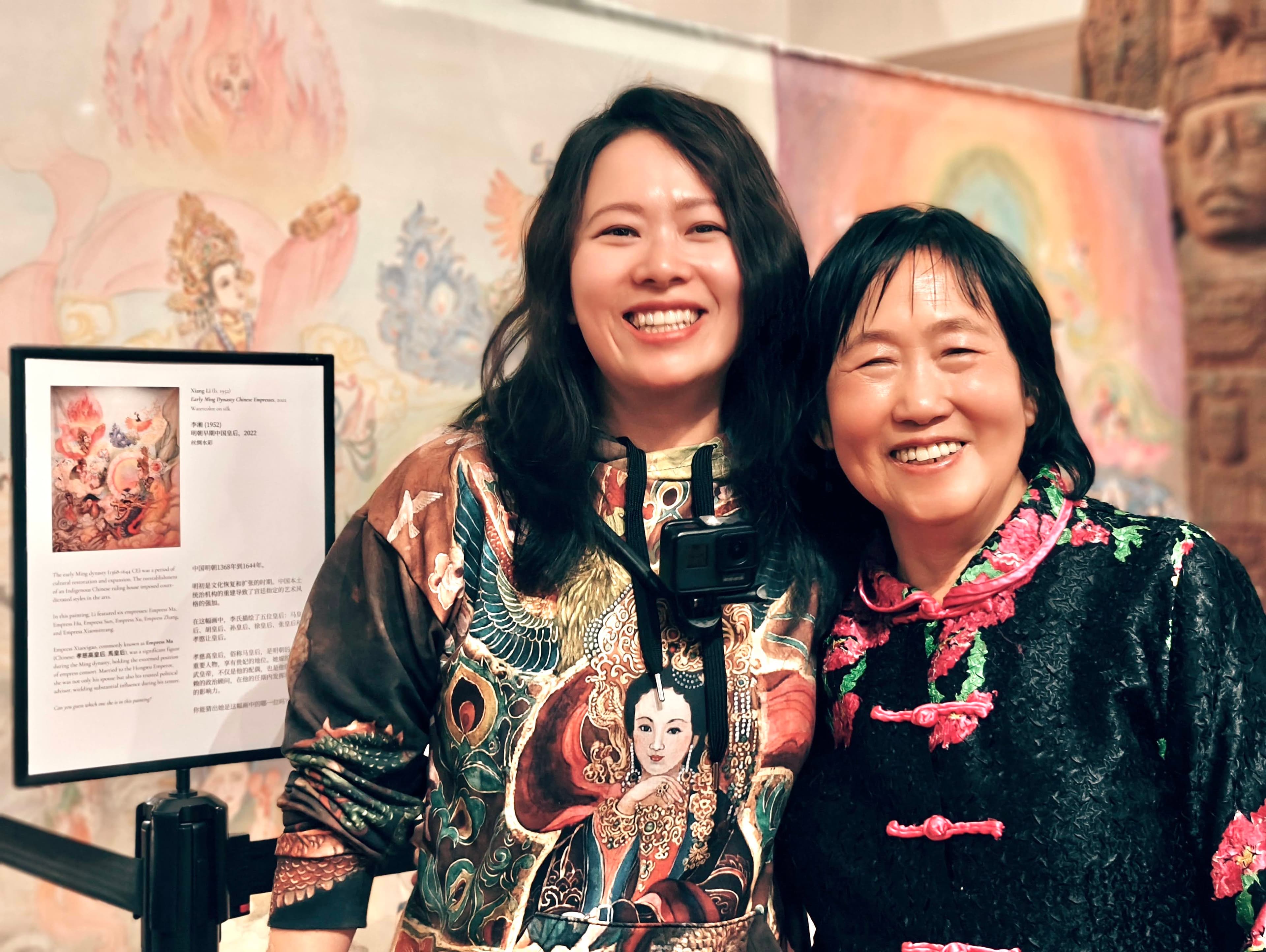 Fei Wu with artist Xiang Li in front of Chinese Empresses artwork