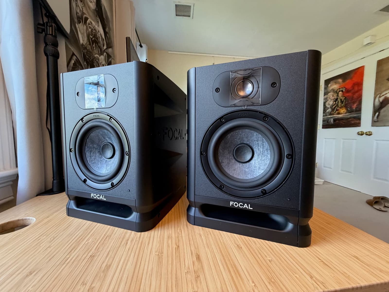 Angled front view of a pair of Focal Alpha 50 Evo studio monitors on a desk