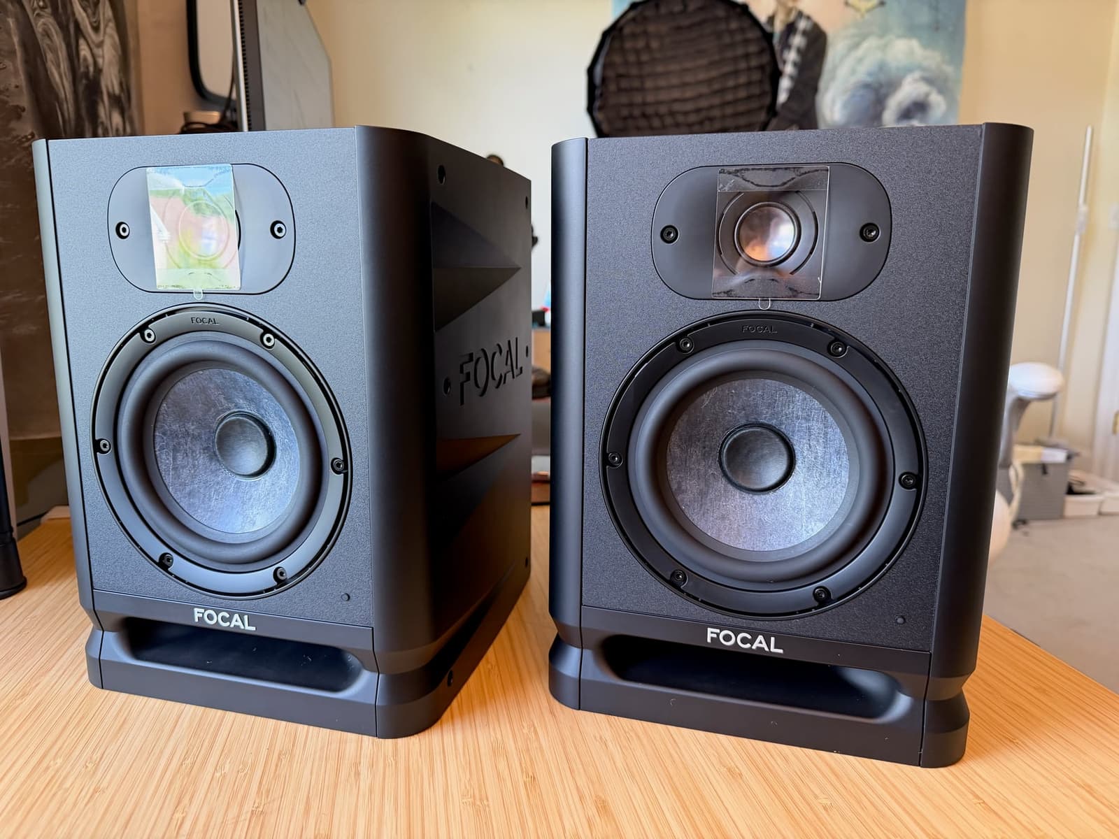 Pair of Focal Alpha 50 Evo studio monitors on a creator studio desk